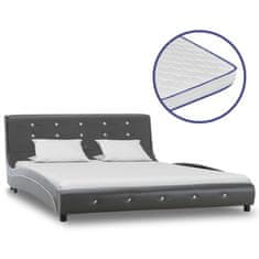 Vidaxl Postelja z vzmetnico iz sp. pene sivo umetno usnje 140x200 cm