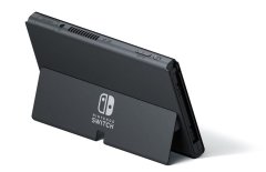 Nintendo Switch OLED igralna konzola + Mario slušalke