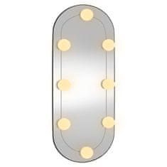 Vidaxl Stensko ogledalo z LED lučkami 25x60 cm stekleno ovalno
