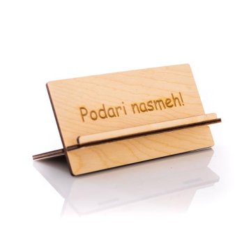 Tetino igrišče Leseno stojalo za telefon ali tablico Lesenko, z napisom "Podari nasmeh!"