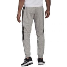 Adidas adidas Essentials hlače s koničastimi manšetami in tremi črtami M GK8976