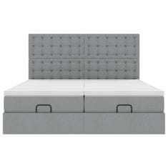 Vidaxl Otomanski posteljni okvir z vzmetnicami siv 180x200 cm blago