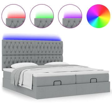 Vidaxl Otomanski posteljni okvir z vzmetnicami siv 180x200 cm blago