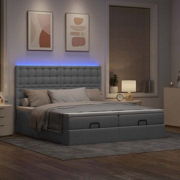 Vidaxl Otomanski posteljni okvir z vzmetnicami siv 200x200 cm blago