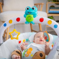 Baby Einstein Kick to It Neptun Glasbeni vibracijski ležalnik z lučkami do 9 kg