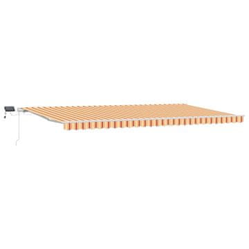 Vidaxl Vlečna tenda Rumena in oranžna 600 × 300 cm Tkanina in aluminij