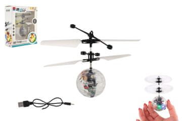 Teddies Helikopterska žogica, ki leti iz plastike 13x11 cm, se sveti in odziva na gibanje roke, kabel USB je prozoren v škatli.