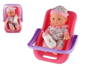 Otroška lutka iz plastike 22 cm s trdnim telesom v nosilcu/avtomobilskem sedežu s stekleničko 2 barvi v blister pakiranju