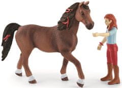 Schleich 42539 lutka rdečelaska Hannah z gibljivimi sklepi, jahanje